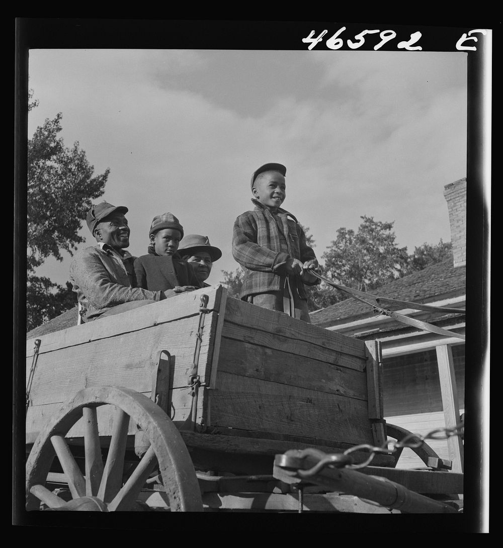 Boyd Jones driving into Greensboro for Saturday afternoon. Greene County, Georgia. Sourced from the Library of Congress.