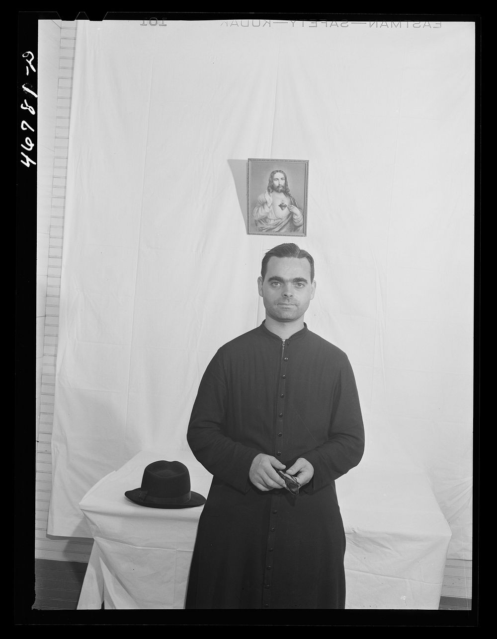 Corozal, Puerto Rico (vicinity). Priest who conducted a mass and the ceremony of baptizing the children and blessing the…