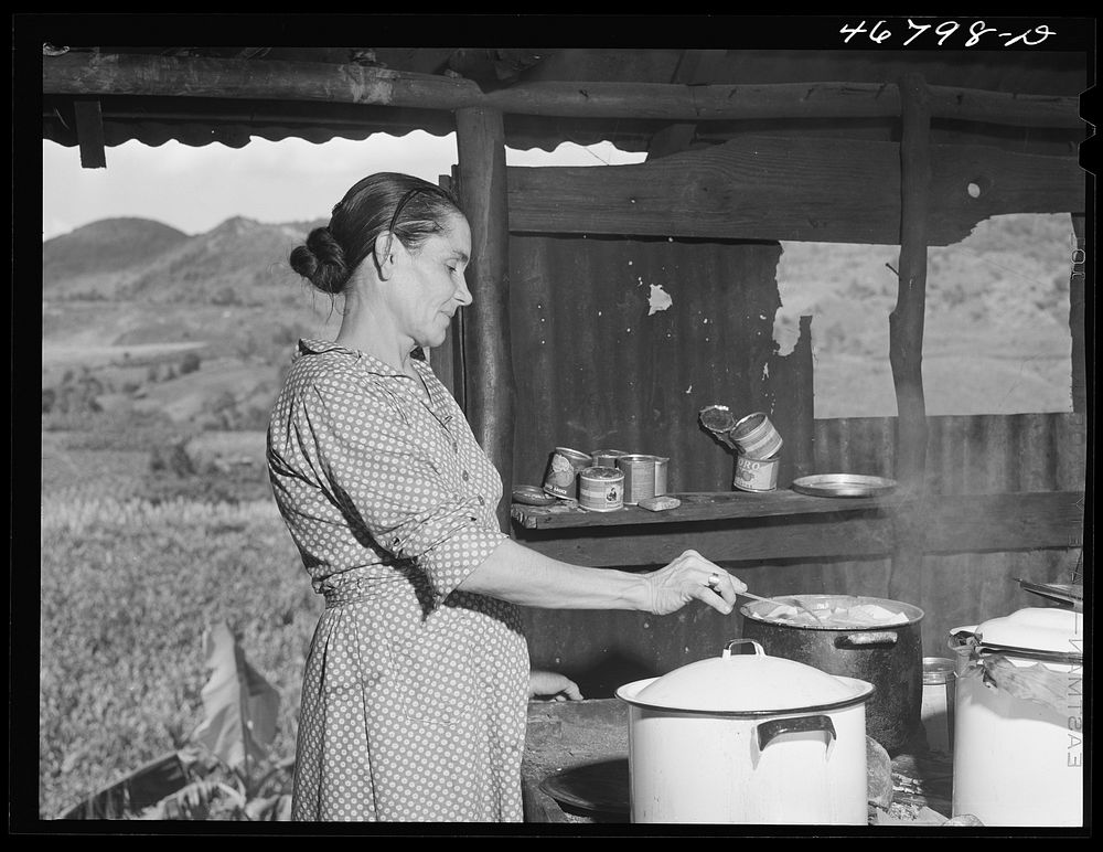 Corozal, Puerto Rico (vicinity). Mrs. Ecequiel Irene cooking "pastellas" during the tenant purchase celebration at her home.…