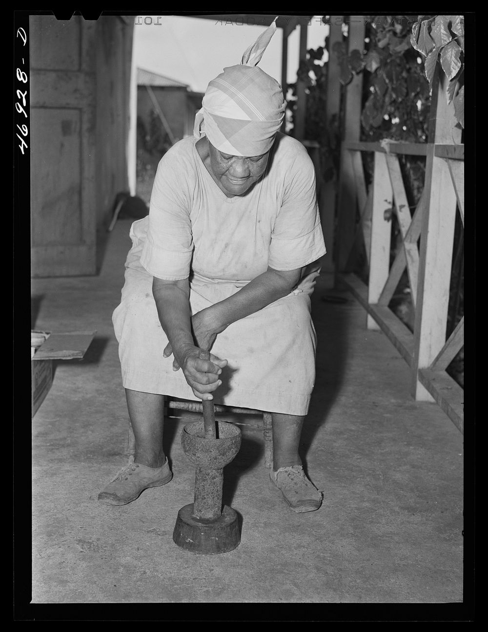 Frederiksted (vicinity), Saint Croix Island, Virgin Islands. FSA (Farm Security Administration) borrower's wife grinding…