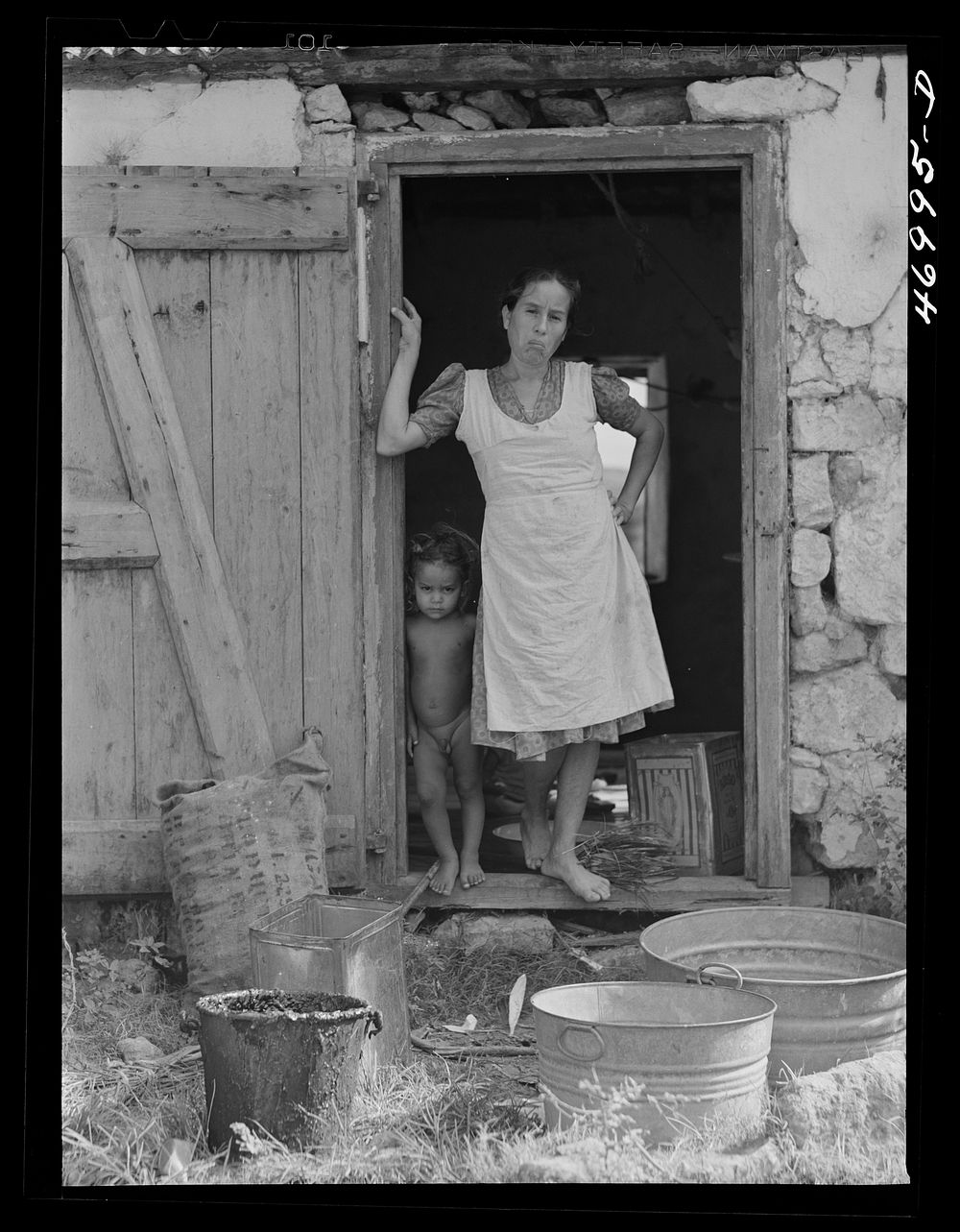 [Untitled photo, possibly related to: Saint Croix Island, Virgin Islands. Puerto Rican woman and her children, FSA (Farm…