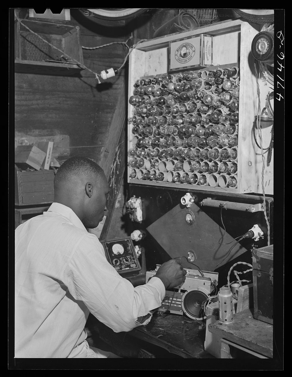 Charlotte Amalie, Saint Thomas Island, Virgin Islands.  radio mechanic who lives in a slum area. Sourced from the Library of…