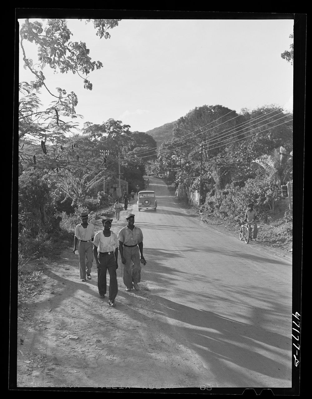 [Untitled photo, possibly related to: Saint Thomas Island, Virgin Islands. Men coming home from work at the Naval base].…