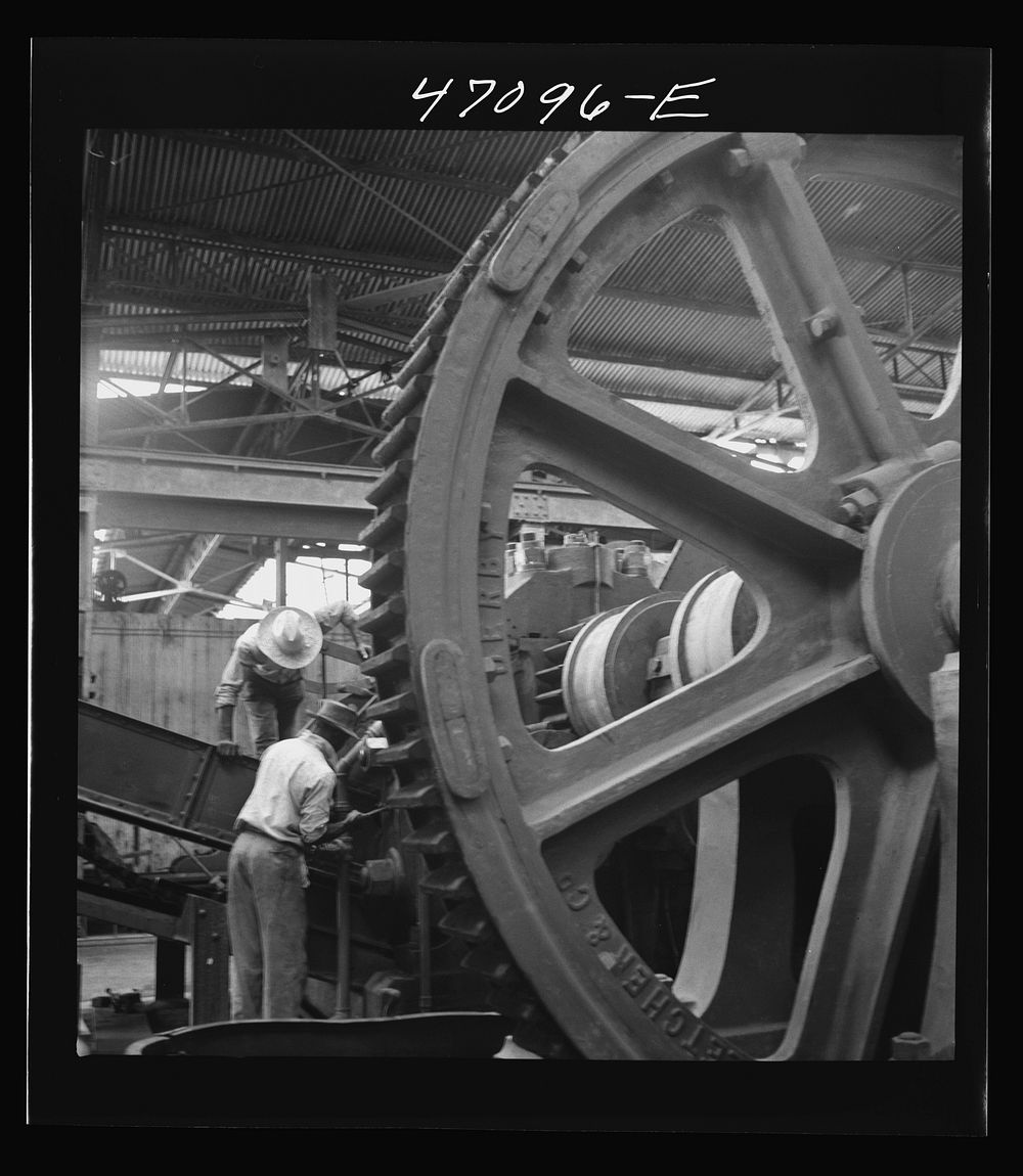 [Untitled photo, possibly related to: Saint Croix Island, Virgin Islands. Reconditioning machinery in the Bethlehem sugar…