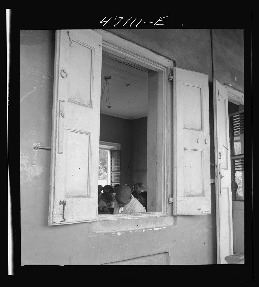 [Untitled photo, possibly related to: Christiansted, Saint Croix Island, Virgin Islands. At a window of the Christiansted…