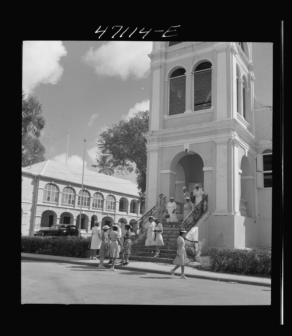 Christiansted, Saint Croix Island, Virgin Islands. Coming out of church on a Sunday. Sourced from the Library of Congress.