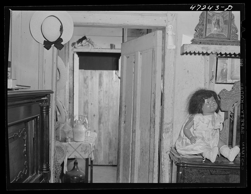 [Untitled photo, possibly related to: Charlotte Amalie, Saint Thomas Island, Virgin Islands. A  doll in one of the houses in…