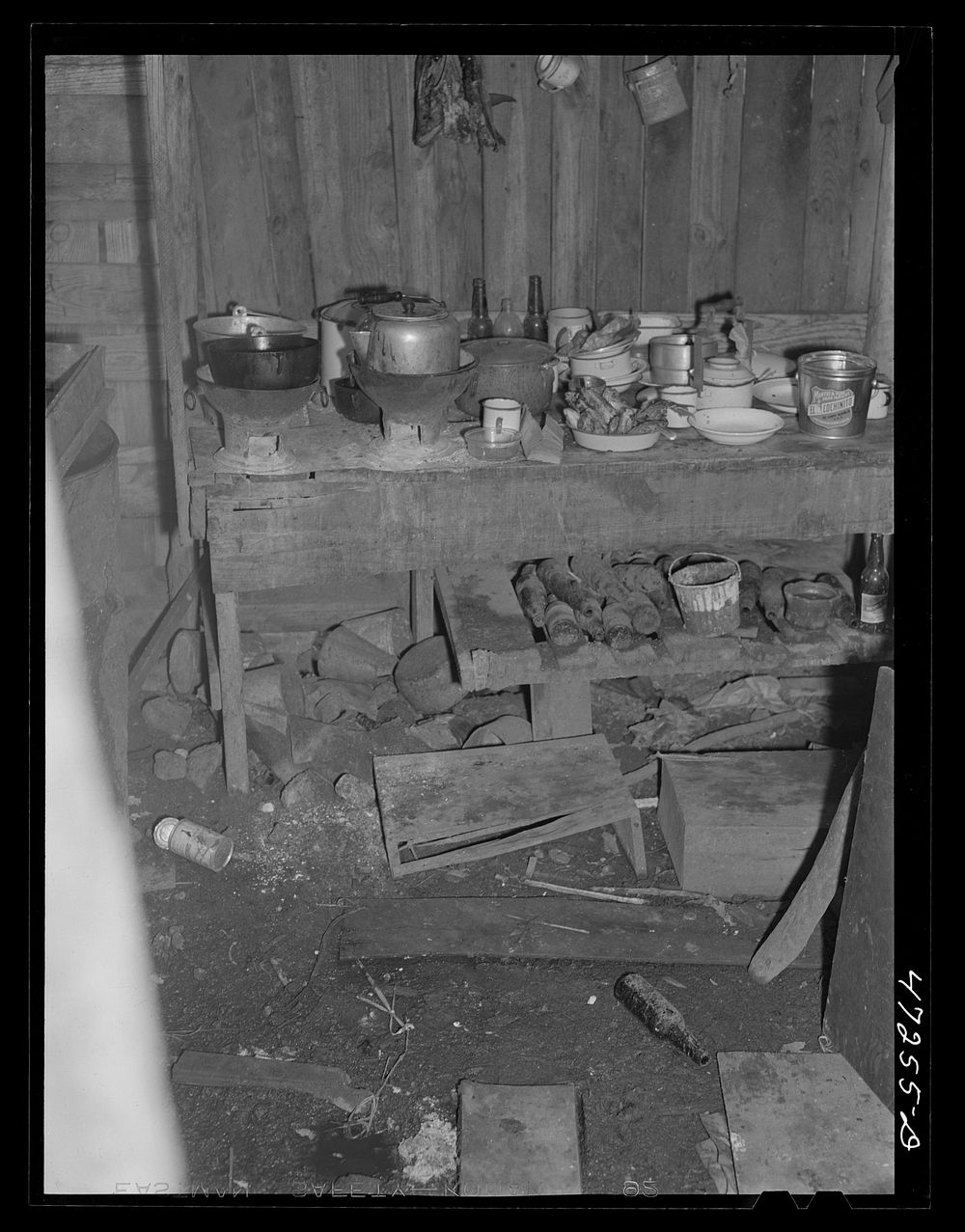Charlotte Amalie, Saint Thomas Island, Virgin Islands. The kitchen in the home of a  worker in a slum section. Sourced from…