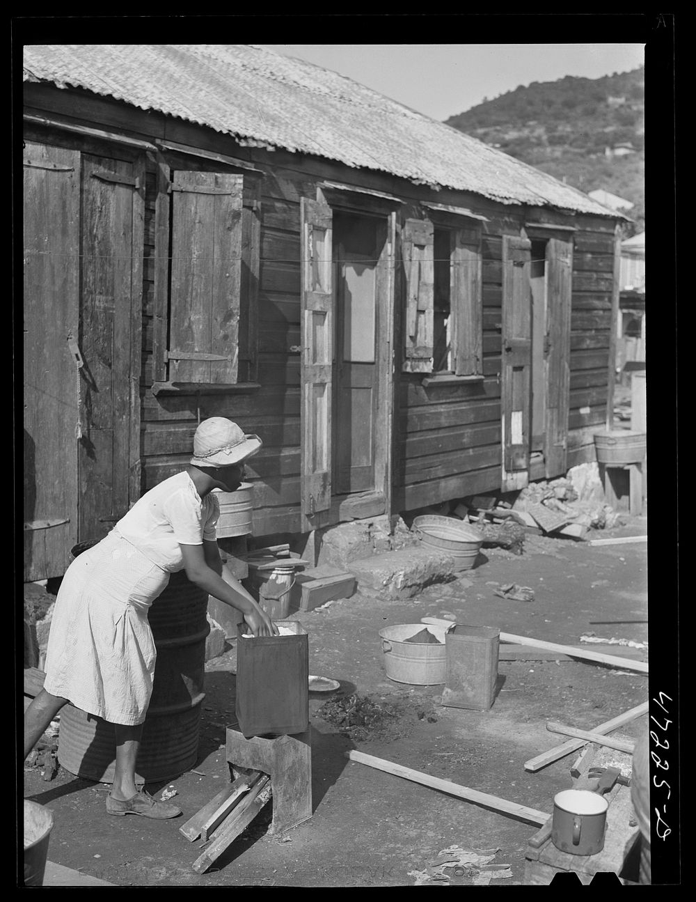 [Untitled photo, possibly related to: Charlotte Amalie, Saint Thomas Island, Virgin Islands. Washing clothes in a slum…