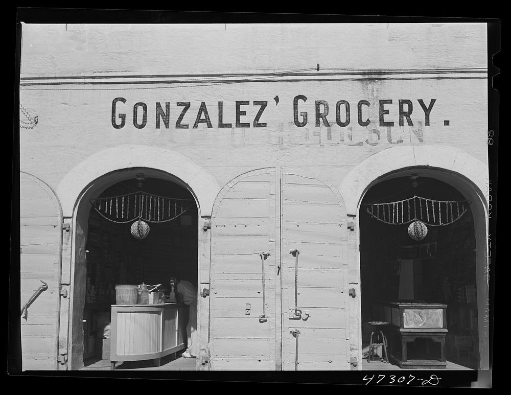 [Untitled photo, possibly related to: Charlotte Amalie, Saint Thomas Island, Virgin Islands. A grocery store along the main…