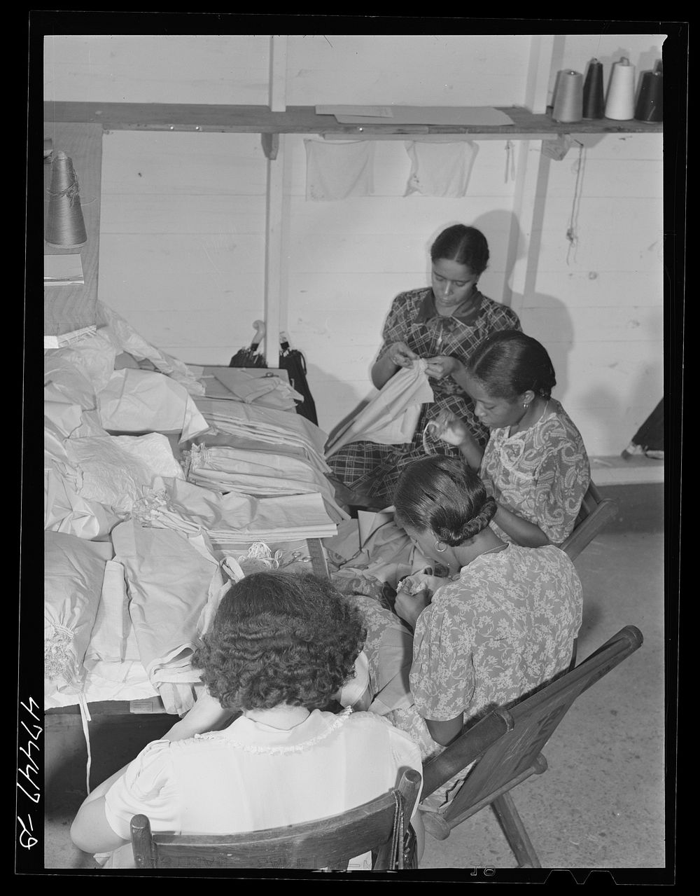 [Untitled photo, possibly related to: Santurce, Puerto Rico. Women working at the Rodriguez needlework factory]. Sourced…