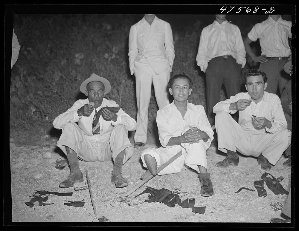 [Untitled photo, possibly related to: Guanica, Puerto Rico (vicinity). Eating "pastellas" at a Three Kings' eve party at the…