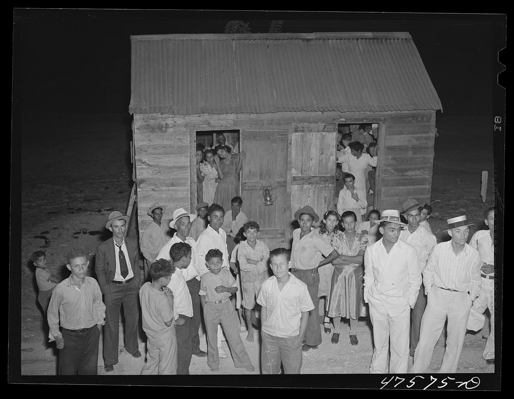 Guanica, Puerto Rico (vicinity) A Three Kings' eve party at the home of a farm labor family. Sourced from the Library of…