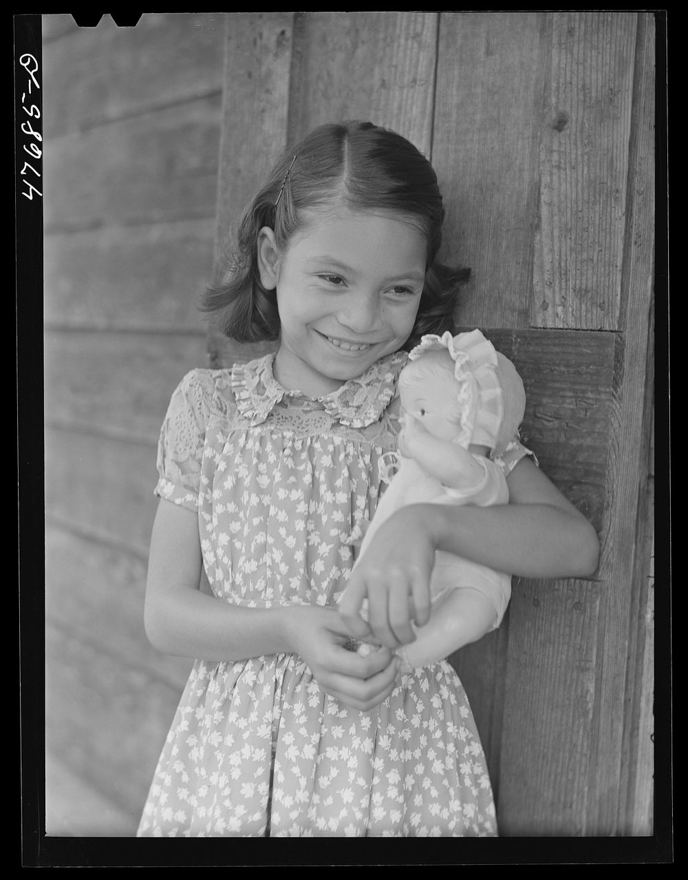 [Untitled photo, possibly related to: Guanica, Puerto Rico (vicinity). One of the children of a tenant farmer and her Three…