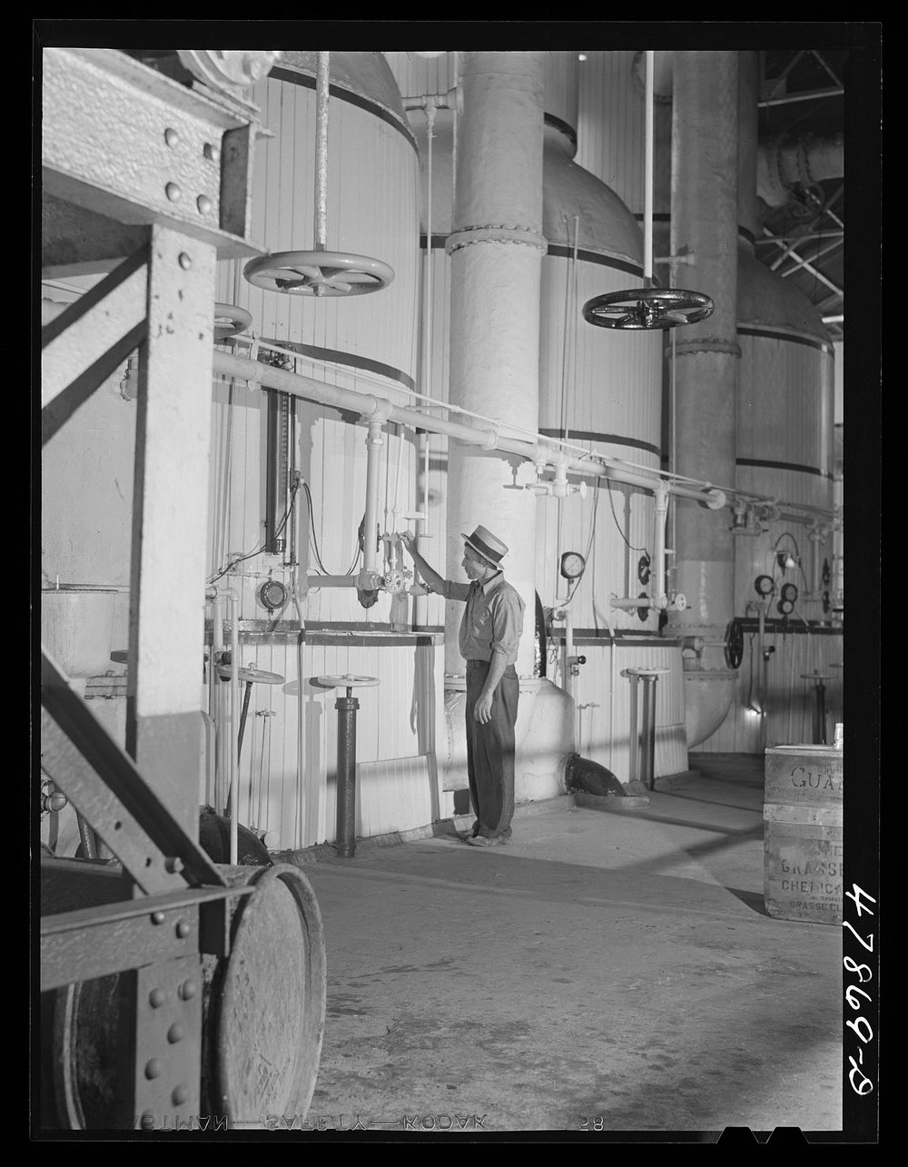 Ensenada, Puerto Rico. Vats for boiling and crystalizing the syrup in the South Puerto Rico Sugar Company. Sourced from the…