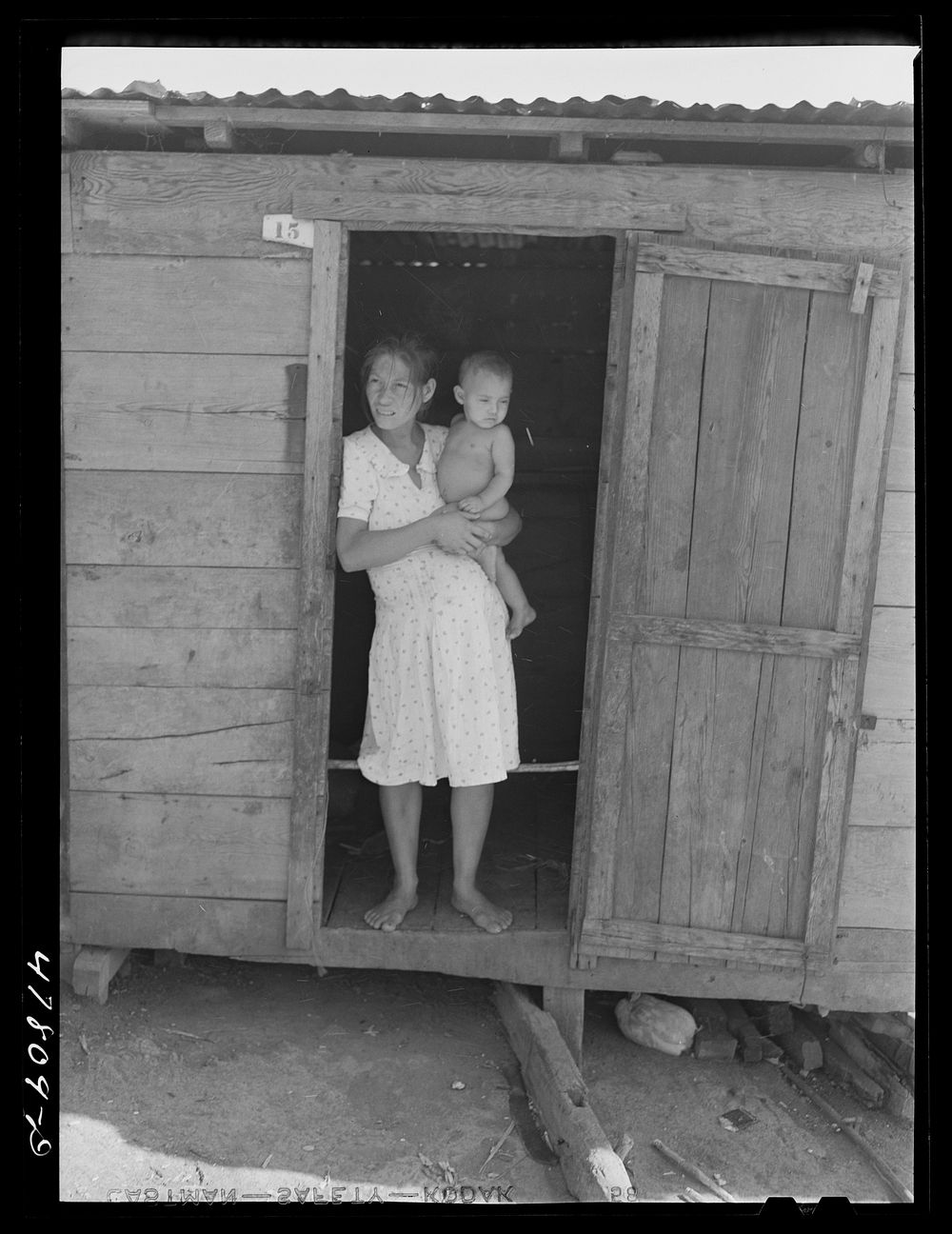Yauco, Puerto Rico (vicinity). Wife and child of a tenant farmer in the hills. Sourced from the Library of Congress.
