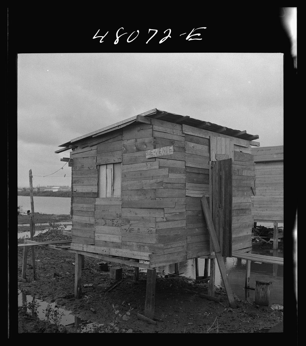 San Juan, Puerto Rico. House for sale in the slum known as "El Fangitto". Sourced from the Library of Congress.