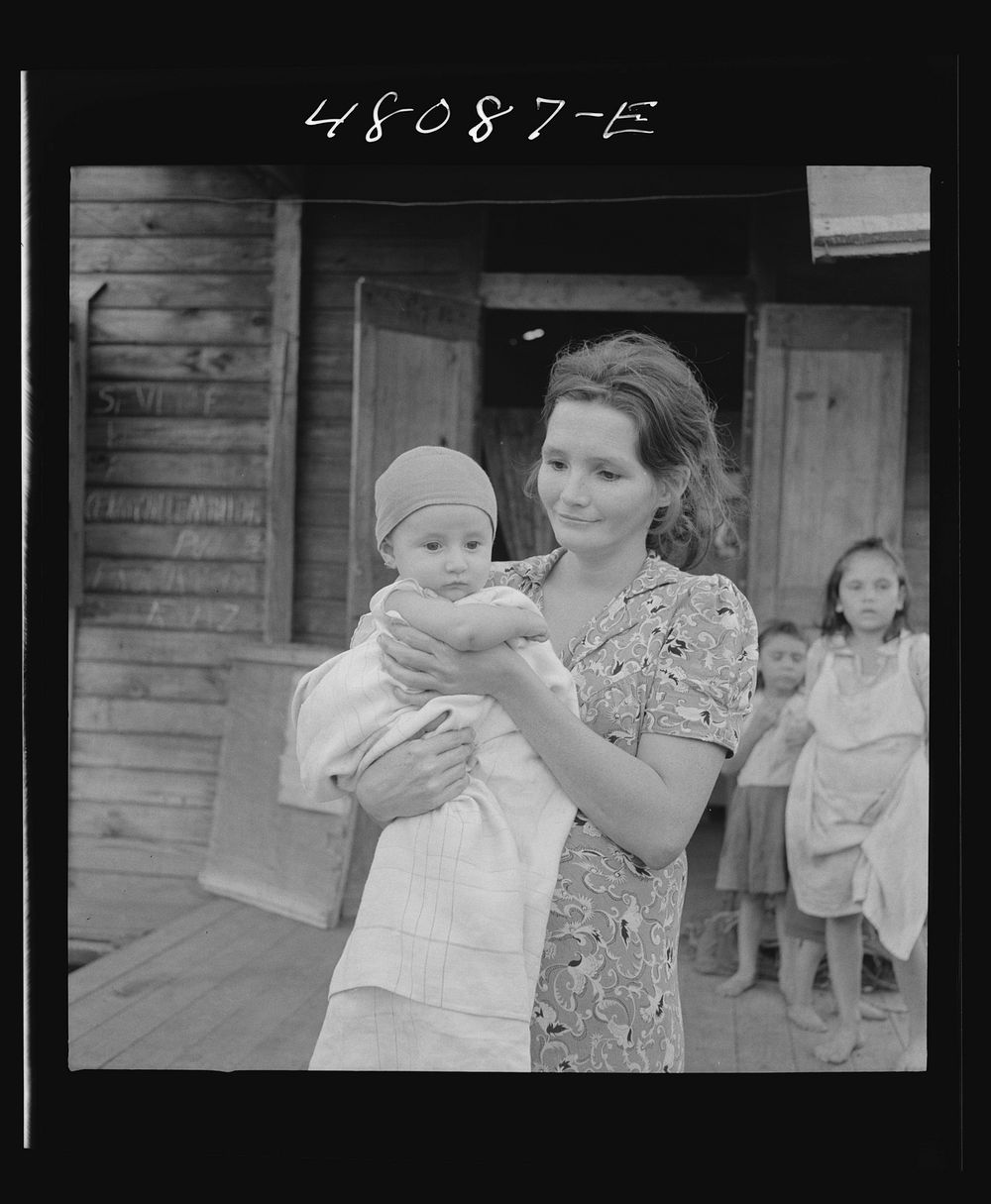 San Juan, Puerto Rico. Mother and child in the slum area known as "El Fangitto". Sourced from the Library of Congress.