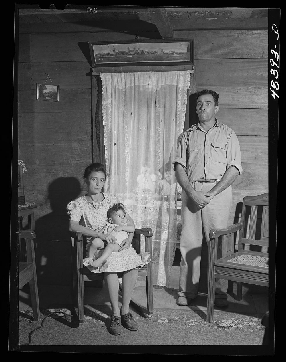 Corozal (vicinity), Puerto Rico. FSA (Farm Security Administration) borrower and his family in their farm home. Sourced from…