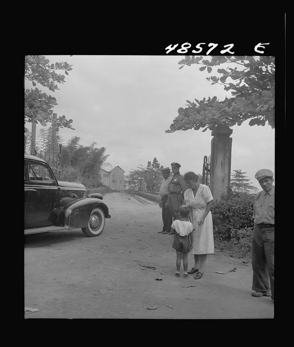 [Untitled photo, possibly related to: Yabucoa, Puerto Rico (vicinity). At the entrance of a sugar mill where the workers are…
