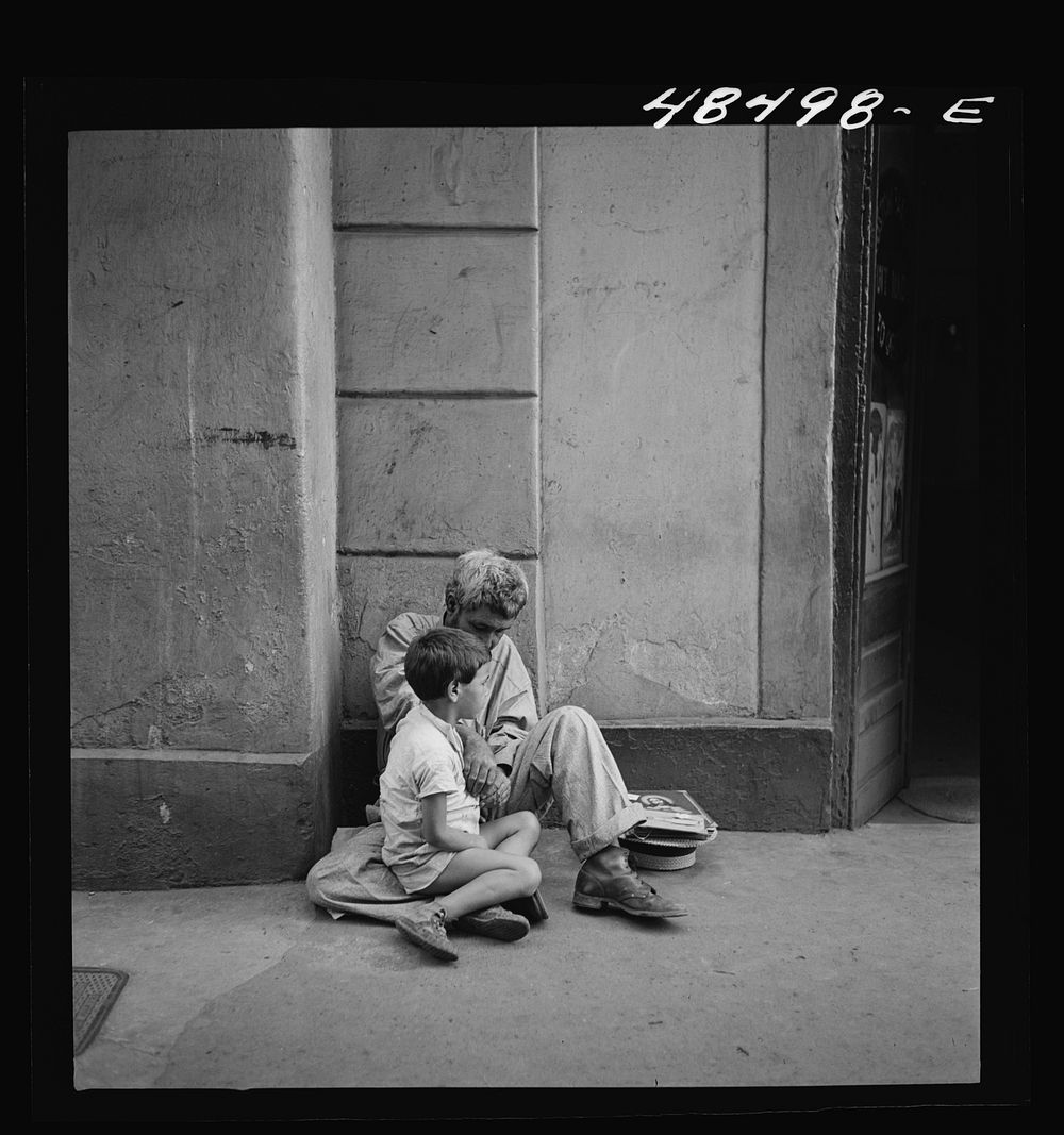 [Untitled photo, possibly related to: San Juan, Puerto Rico. Beggar and child on a street]. Sourced from the Library of…