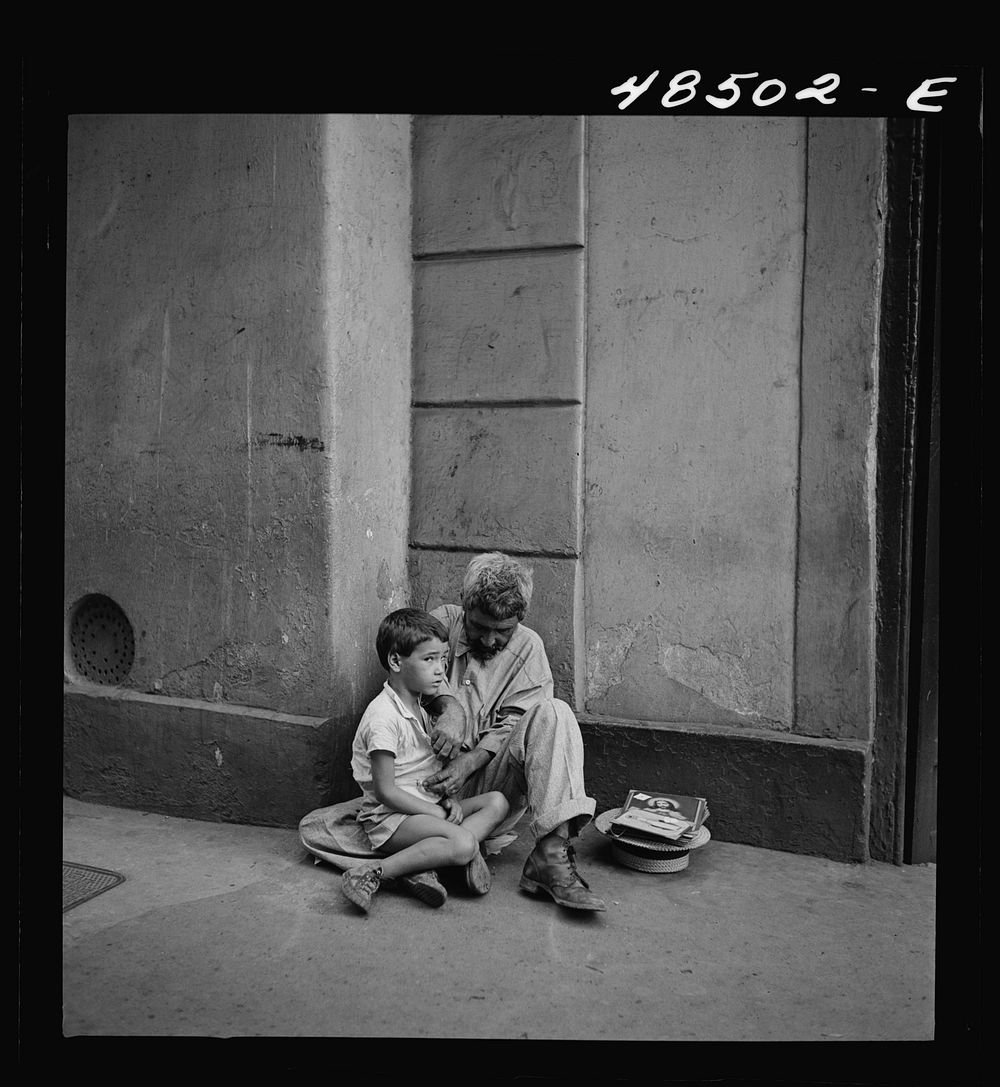 [Untitled photo, possibly related to: San Juan, Puerto Rico. Beggar and child on a street]. Sourced from the Library of…