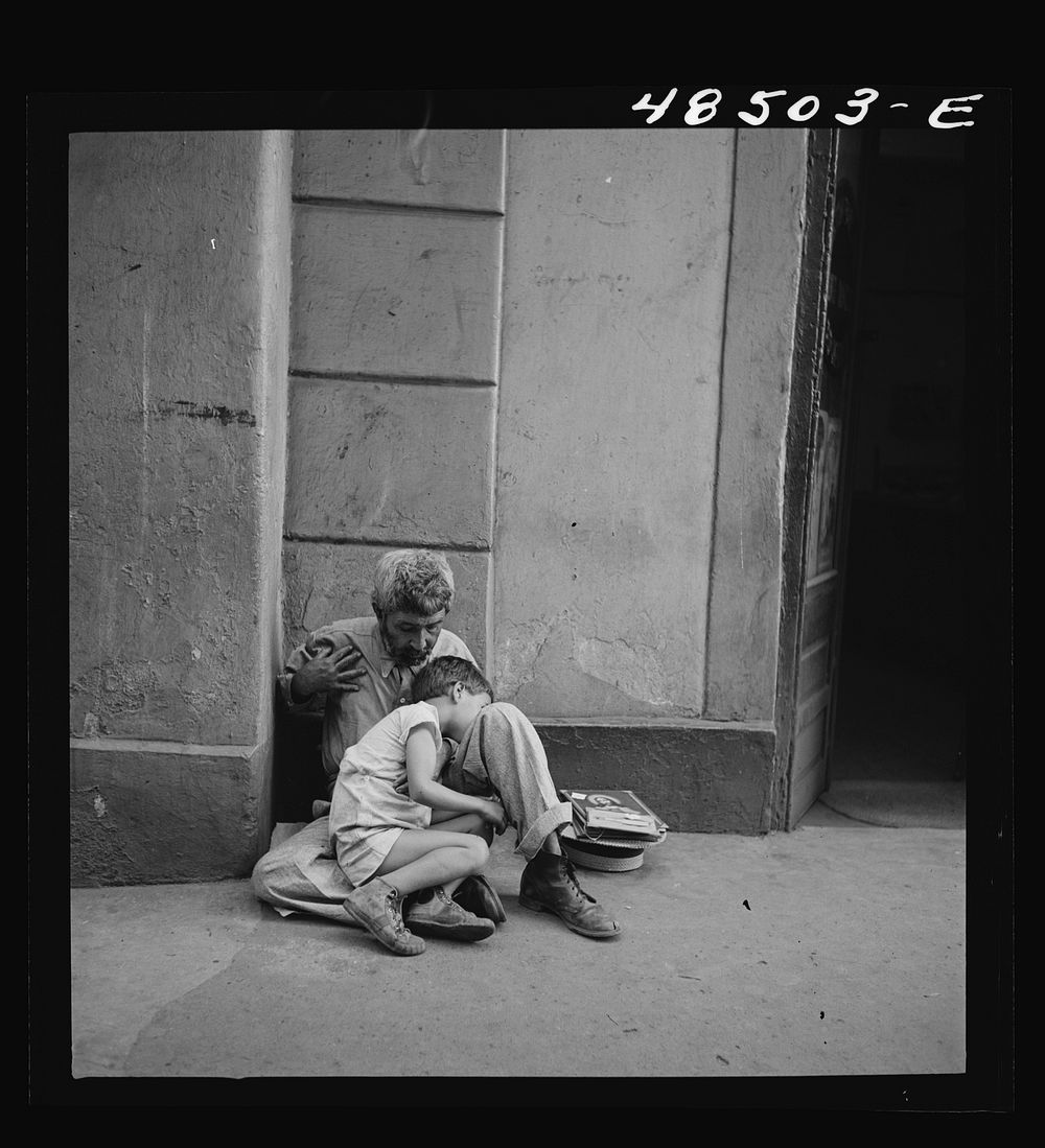 San Juan, Puerto Rico. Beggar and child on a street. Sourced from the Library of Congress.