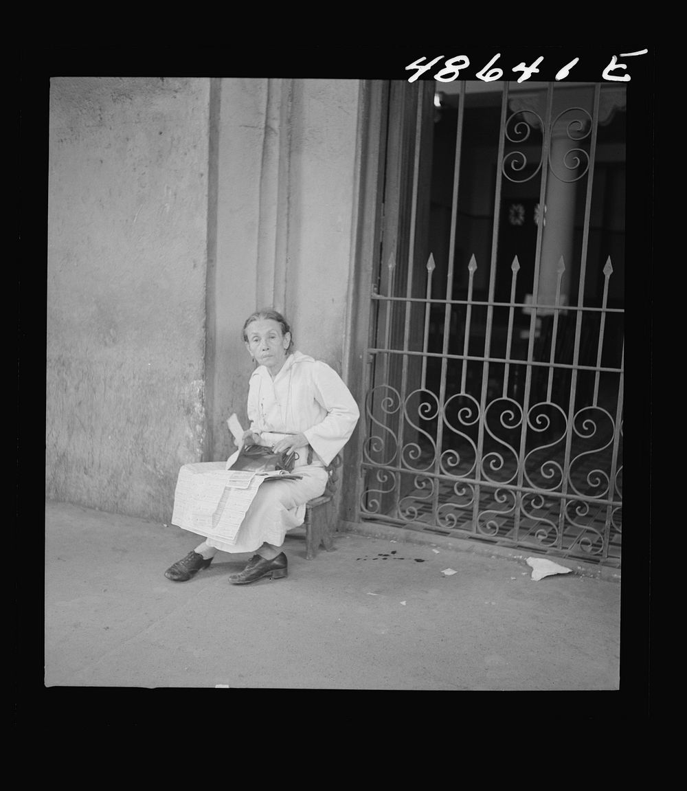 [Untitled photo, possibly related to: San Juan, Puerto Rico. Selling lottery tickets on the street]. Sourced from the…