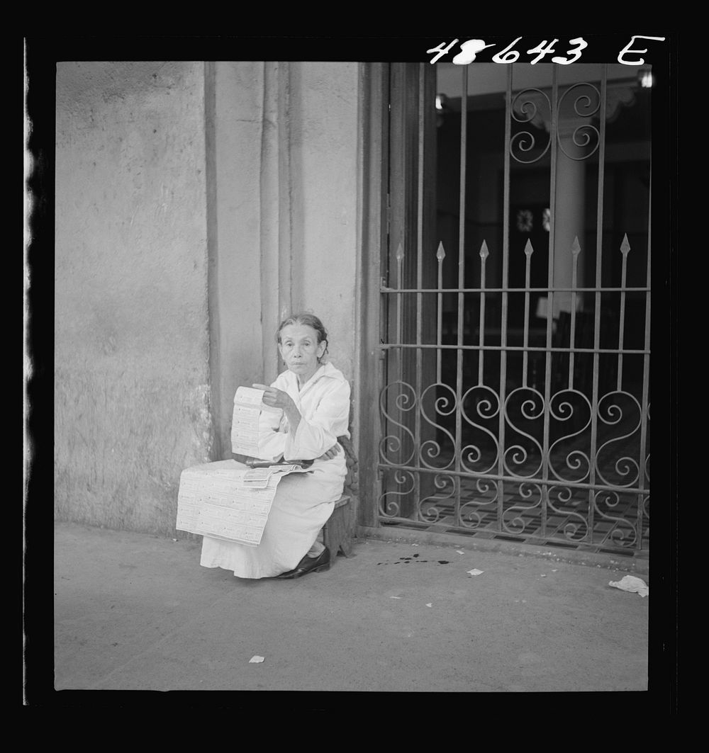 [Untitled photo, possibly related to: San Juan, Puerto Rico. Selling lottery tickets on the street]. Sourced from the…