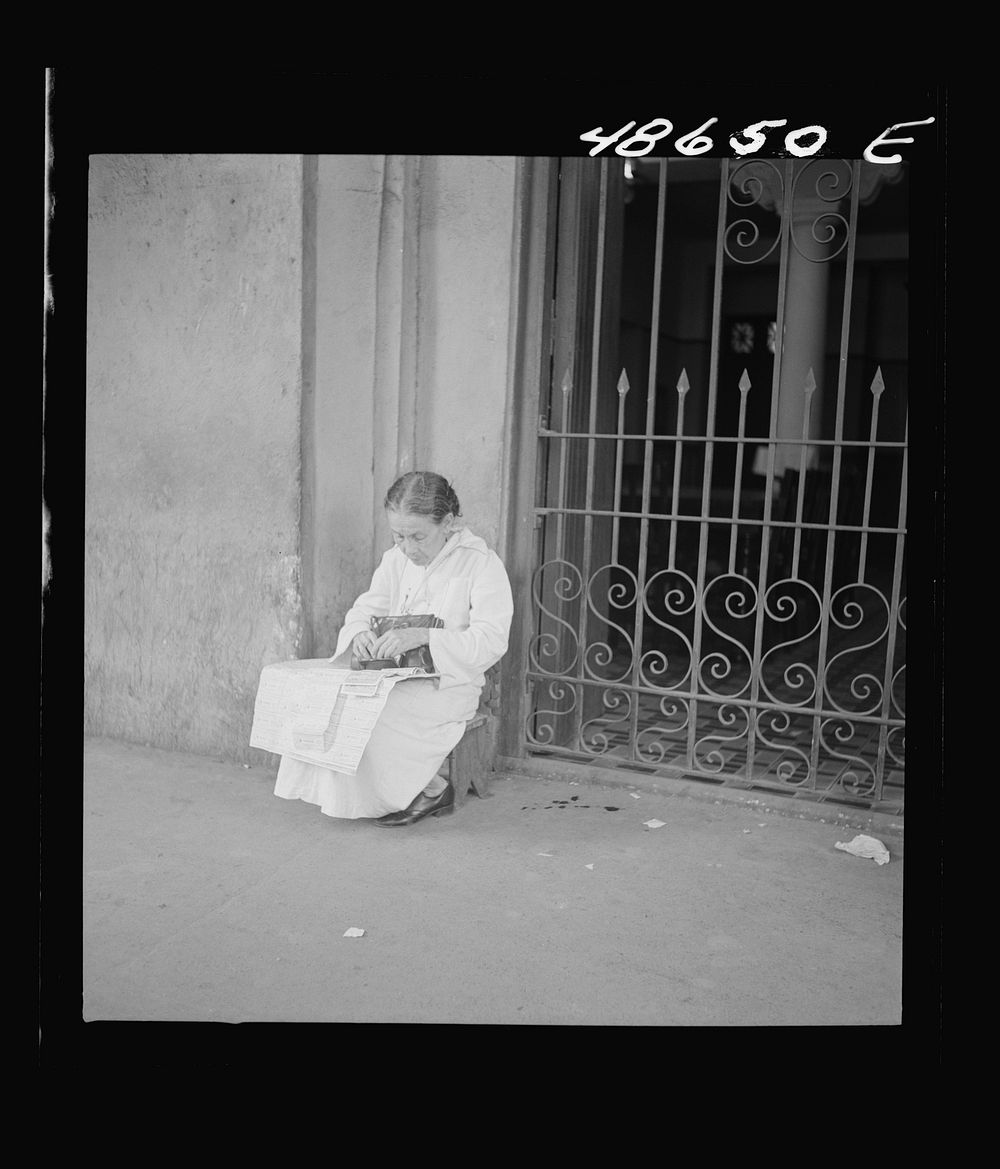 [Untitled photo, possibly related to: San Juan, Puerto Rico. Selling lottery tickets on the street]. Sourced from the…