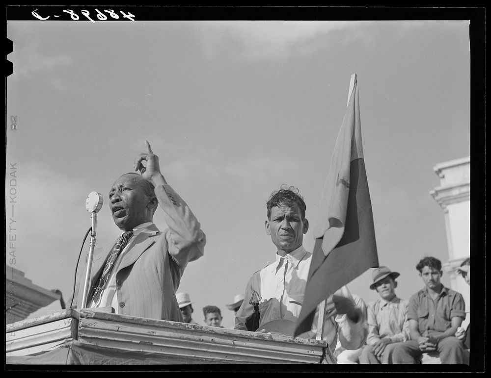 Yabucoa, Puerto Rico. Union leader speaking to strikers at a meeting in the plaza. Sourced from the Library of Congress.