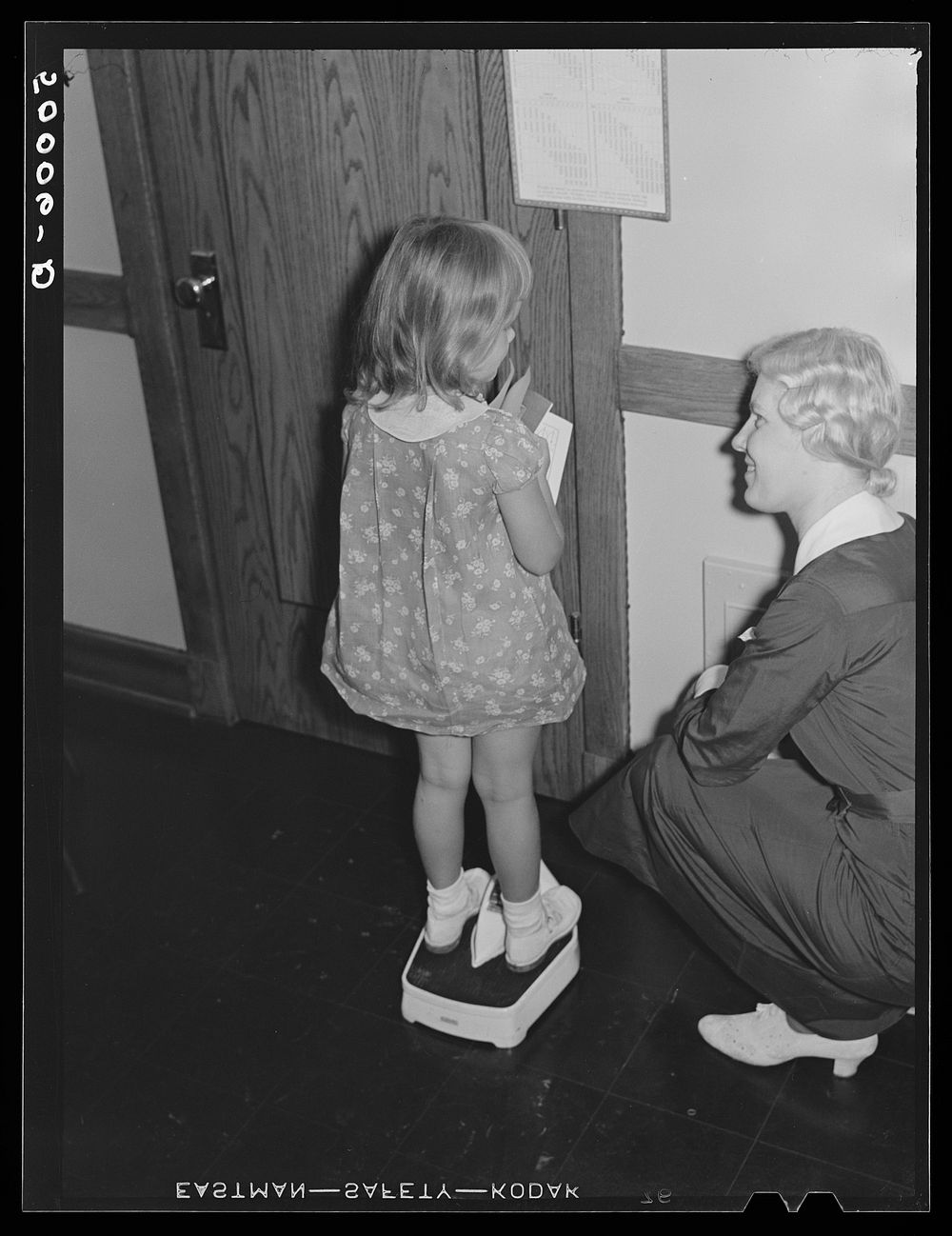 [Untitled photo, possibly related to: Clinic in Greenbelt, Maryland for preschool checkups]. Sourced from the Library of…