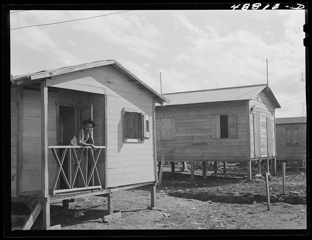 [Untitled photo, possibly related to: San Juan, Puerto Rico. Worker from the naval base in San Juan who lives in this house…