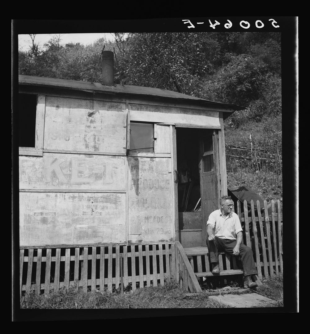 [Untitled photo, possibly related to: Unemployed miner's home he built. "It'll be purtier when I paint it." Scott's Run…