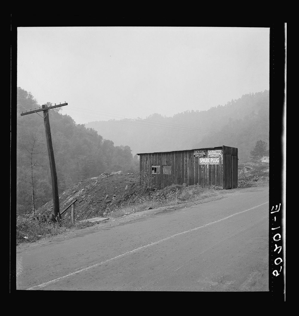 [Untitled photo, possibly related to: Shack by burning slag heap on main country road near Mohegan, West Virginia]. Sourced…