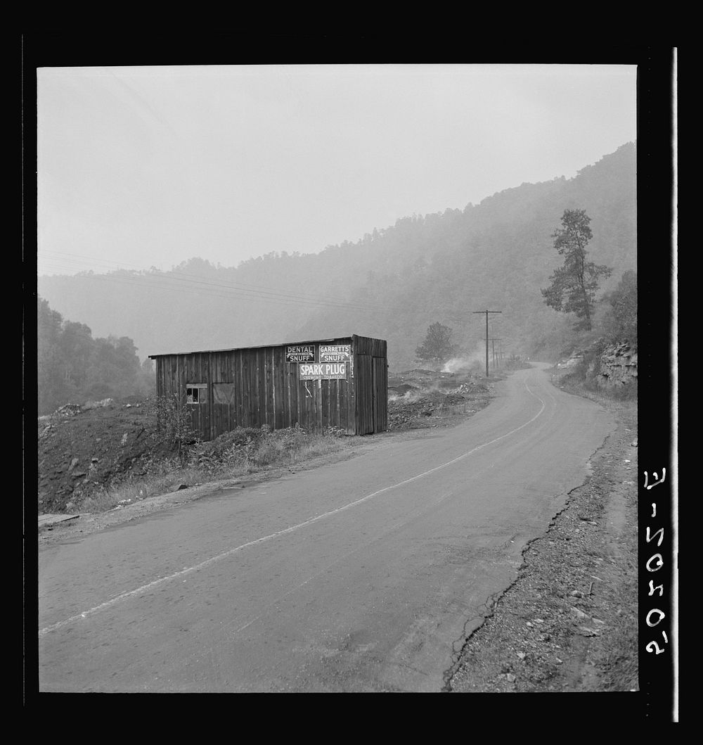 Shack by burning slag heap on main country road near Mohegan, West Virginia. Sourced from the Library of Congress.