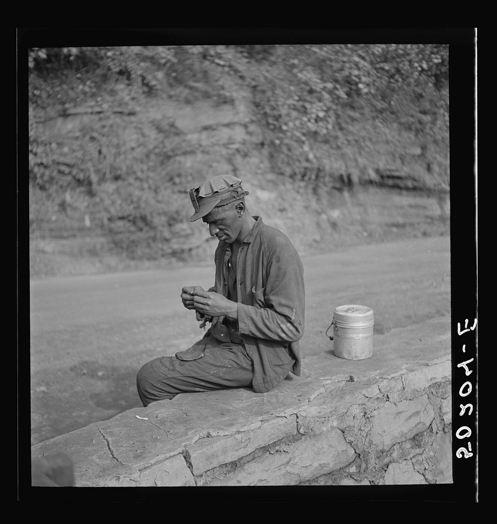 Coal miner waiting for truck to go home. Capels, West Virginia. Sourced from the Library of Congress.