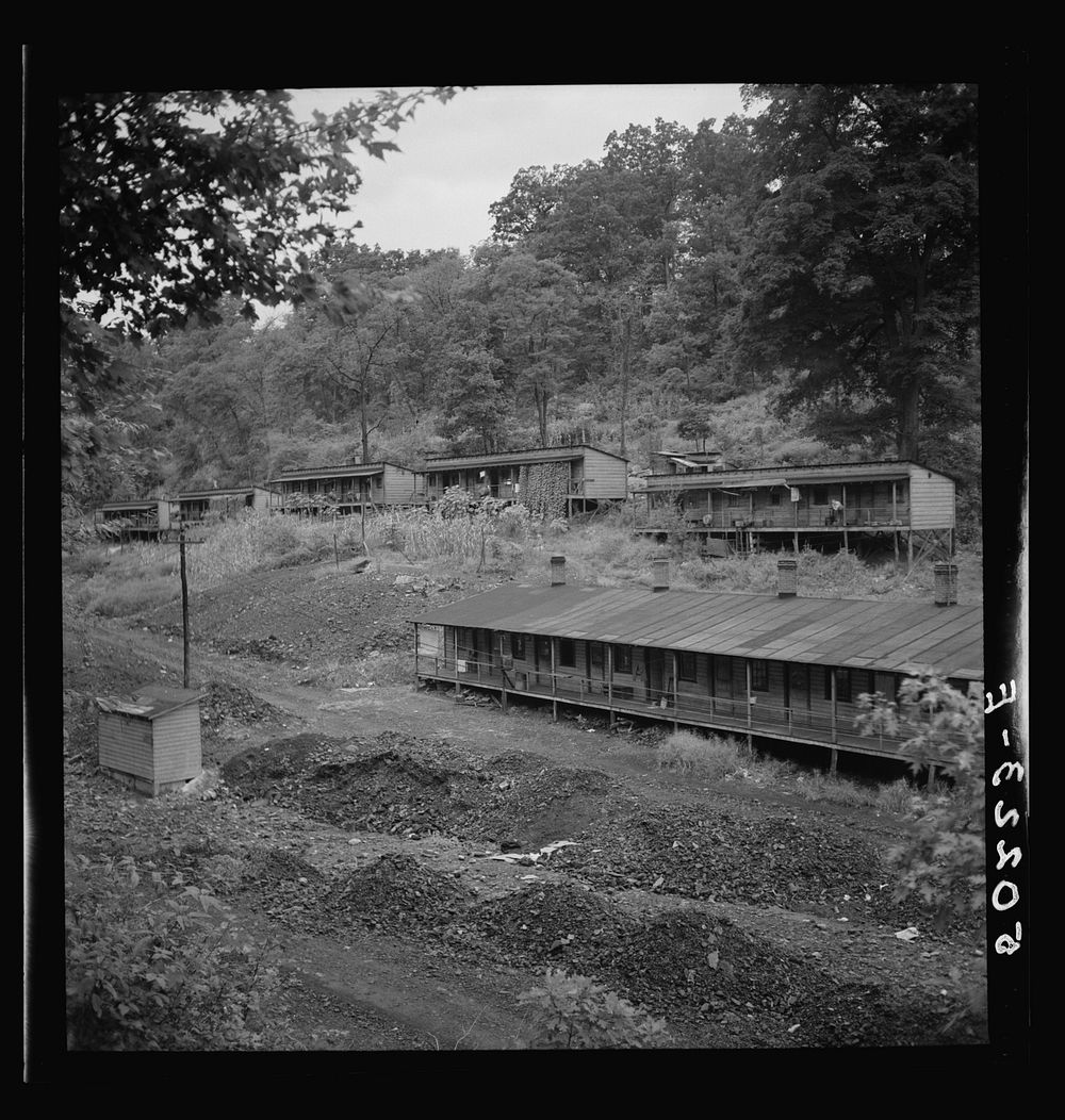 Coal miners' homes, company houses, with piles of old slag and slate. "The Patch," Cassville, West Virginia. Sourced from…
