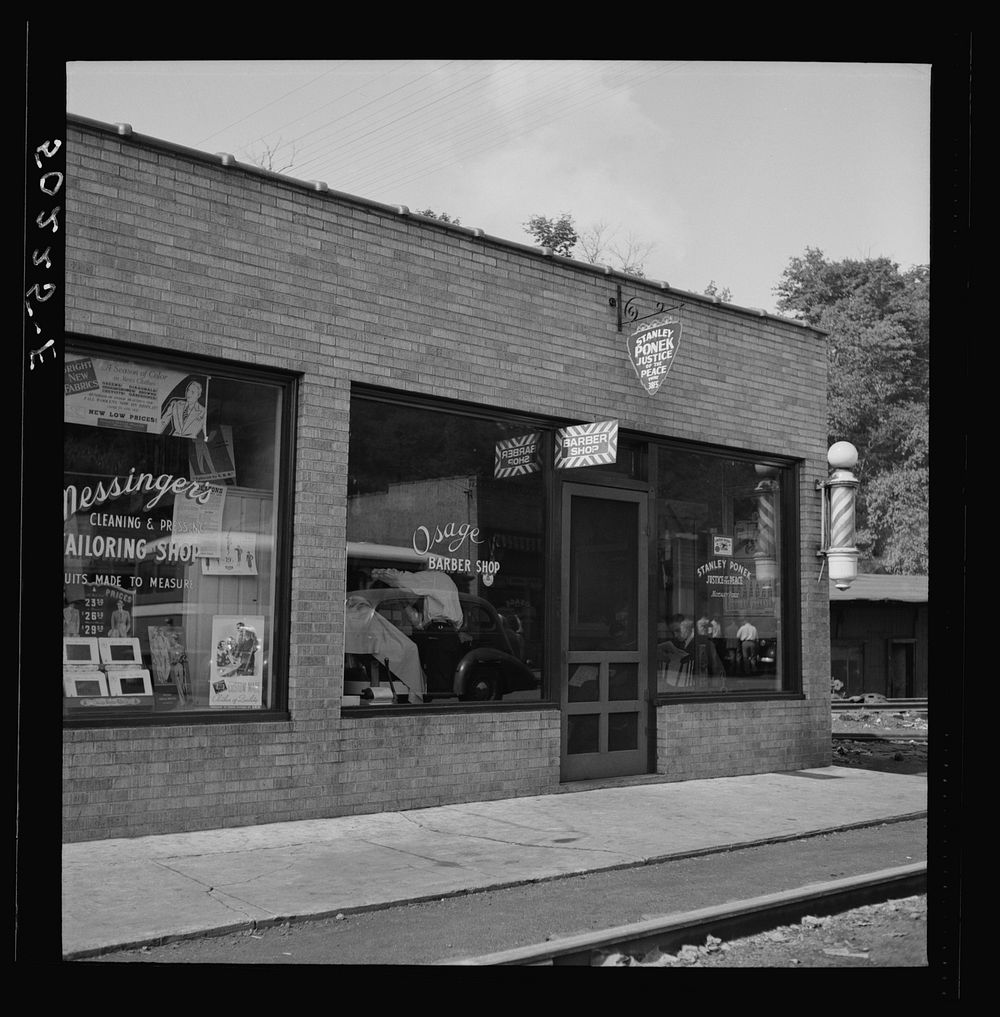 Stores in center of mining town. The barber is also the Justice of Peace.  Osage, West Virginia. Sourced from the Library of…