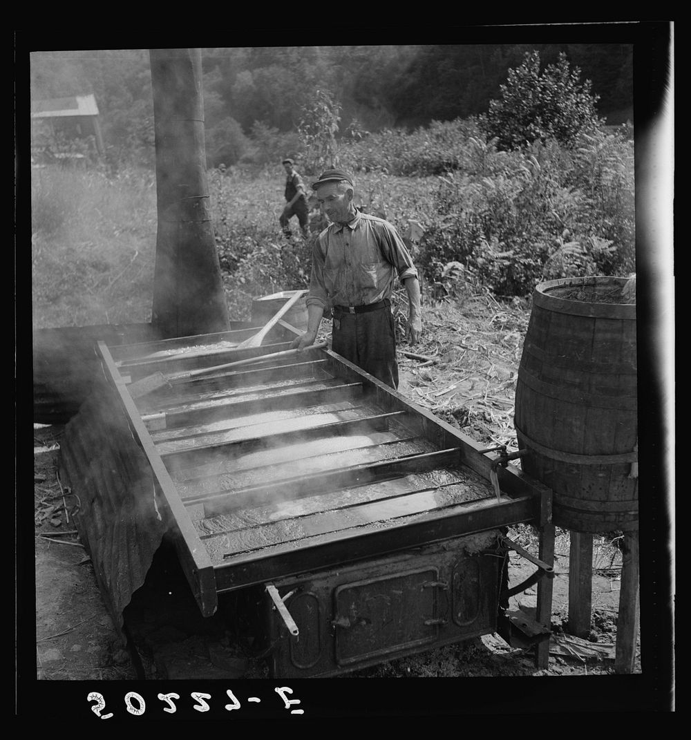 Skimming sorghum molasses. Racine, West Virginia. Sourced from the Library of Congress.