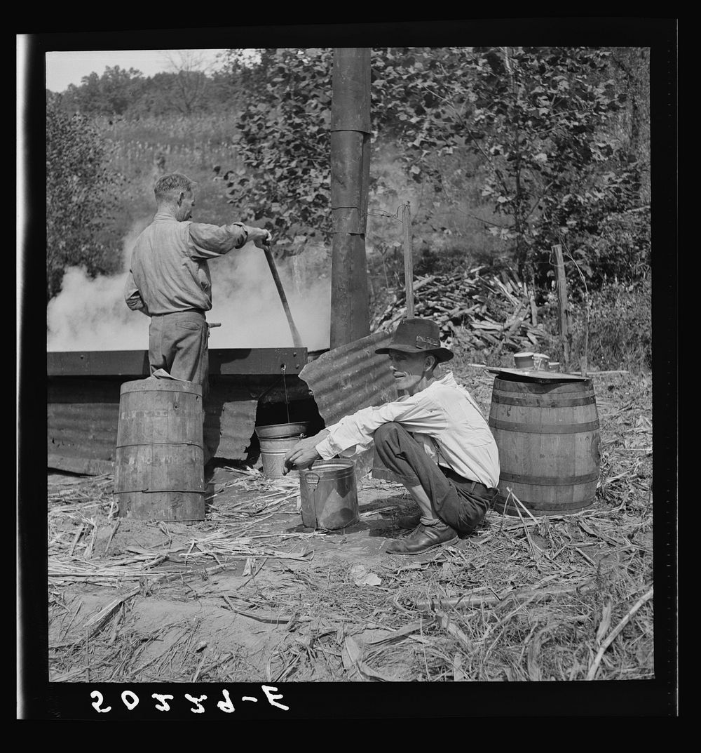 Skimming sorghum molasses. Racine, West Virginia. Sourced from the Library of Congress.