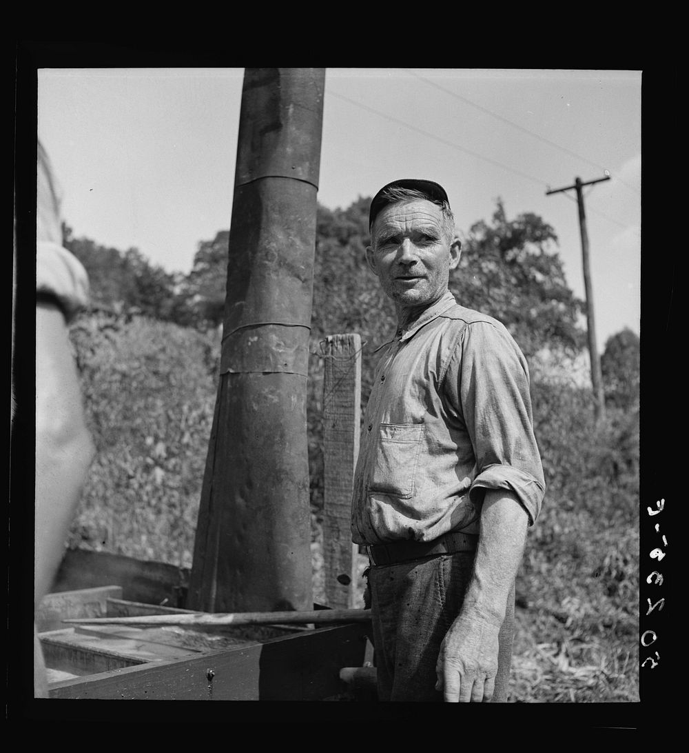 Farmer making molasses from sugarcane. Racine, West Virginia. Sourced from the Library of Congress.