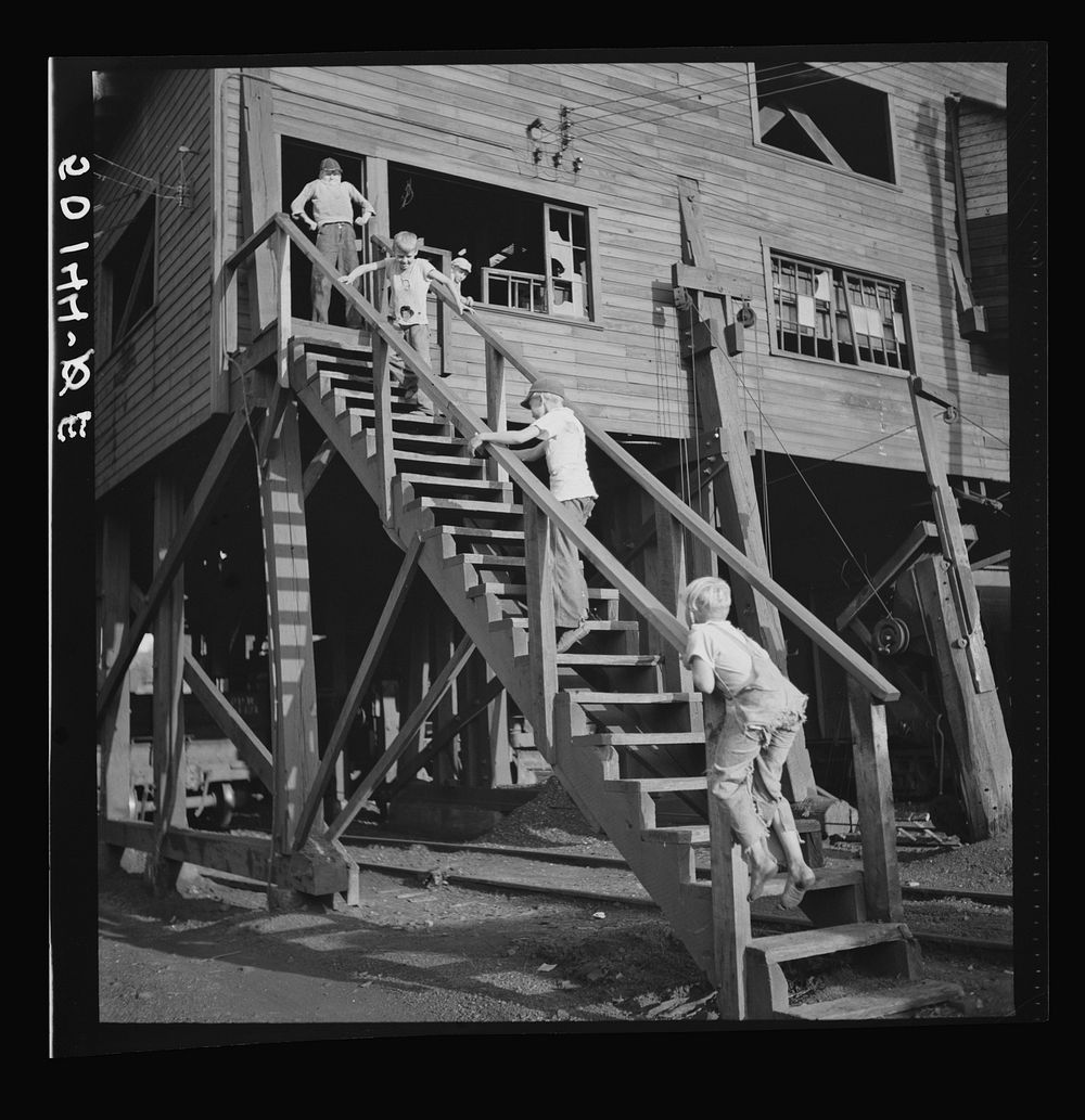 Children playing around old coal tipple. Scotts Run, West Virginia. Sourced from the Library of Congress.