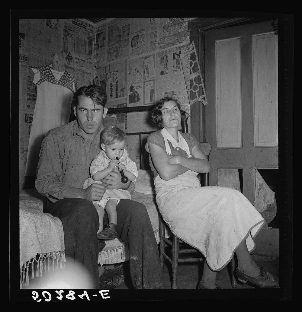 Coal miner, his wife and one of their many children. Bertha Hill, West Virginia. Sourced from the Library of Congress.