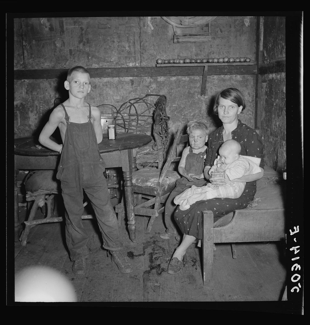Coal miner's wife and three of their children. Company house, Pursglove, Scotts Run, West Virginia. Sourced from the Library…