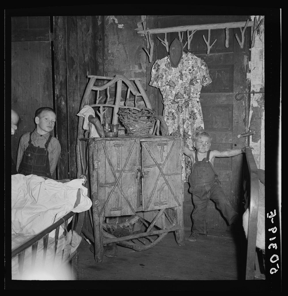 Homemade cared furniture in bedroom of coal miner's home. A company house, Pursglove, Scotts Run, West Virginia. Sourced…
