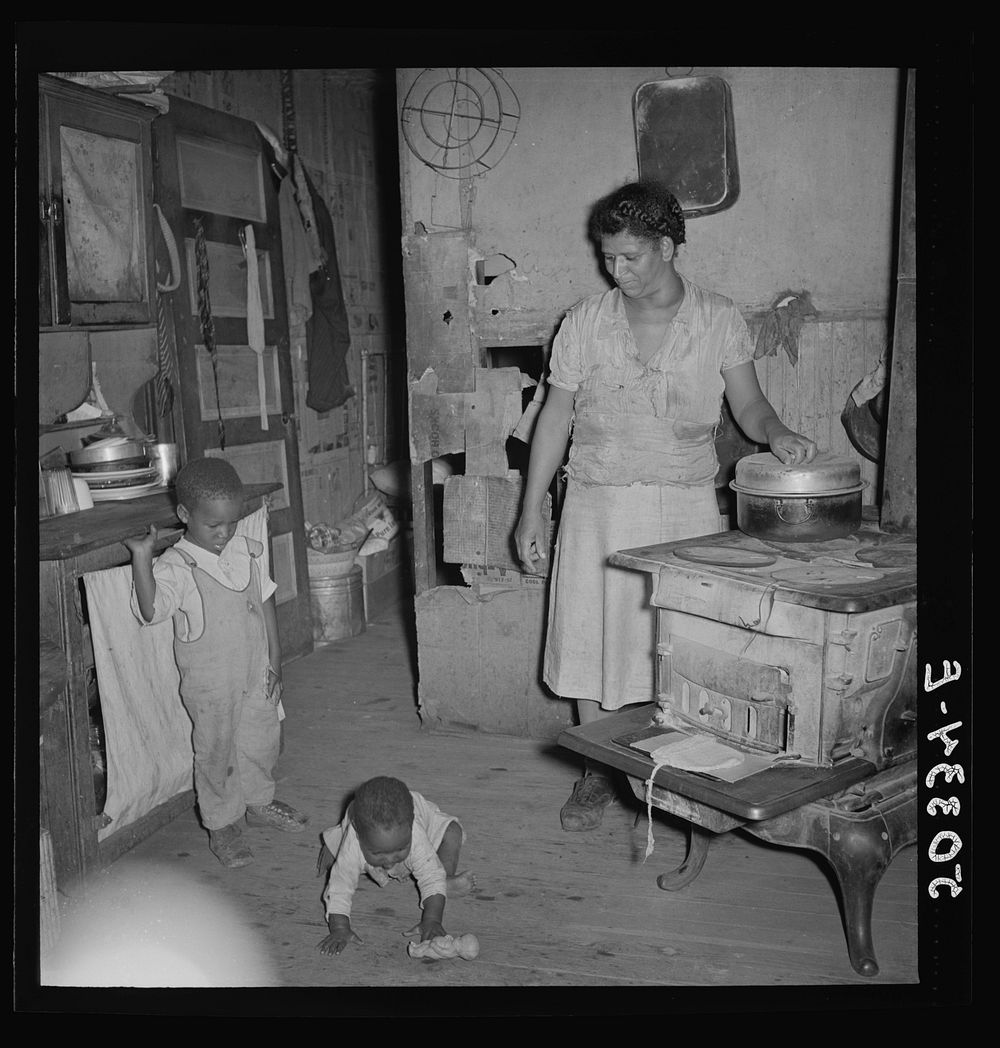 Coal miner's wife (note goiter) and two children. Chaplin, West Virginia. Sourced from the Library of Congress.
