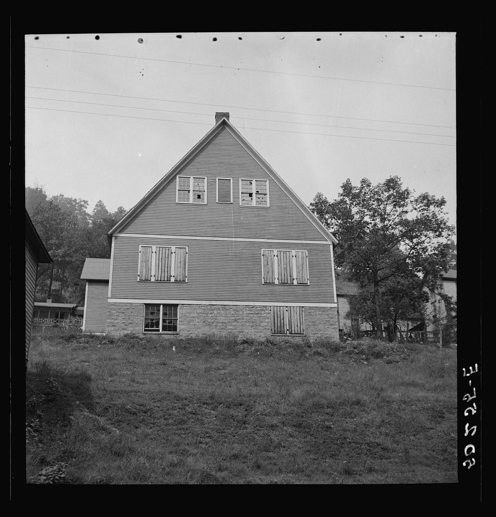 [Untitled photo, possibly related to: Boarded-up homes in abandoned mining town. Twin Branch, West Virginia. Once very nice…