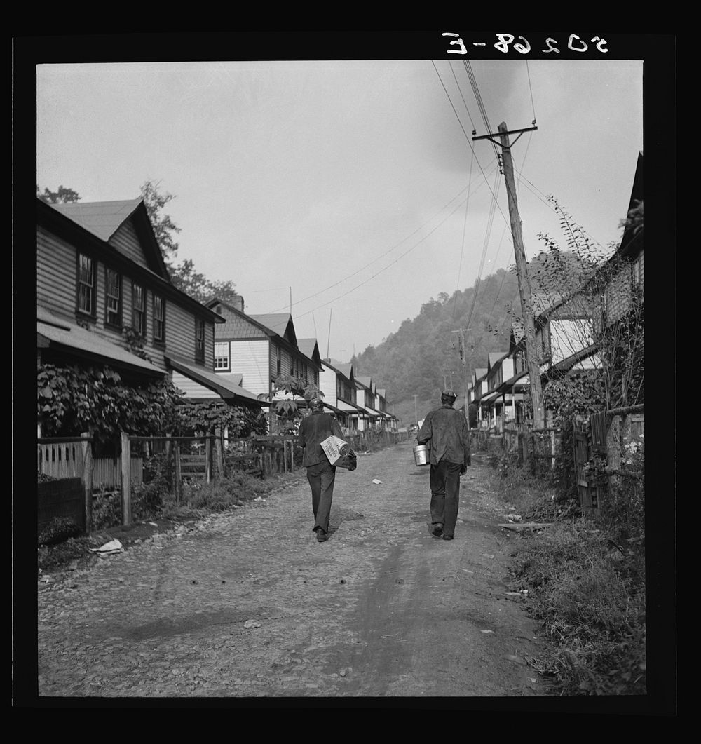 Coal miners going home. Company houses, Capels, West Virginia. Sourced from the Library of Congress.