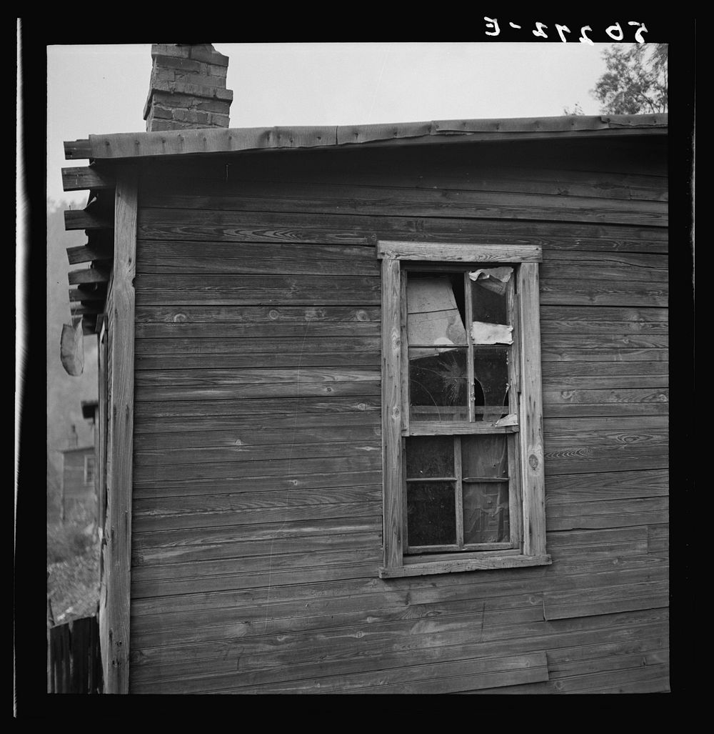 [Untitled photo, possibly related to: Boarded-up homes in abandoned mining town. Twin Branch, West Virginia. Once very nice…